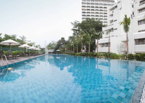 The outdoor sparkling pool, offering an inviting respite from the day's heat
