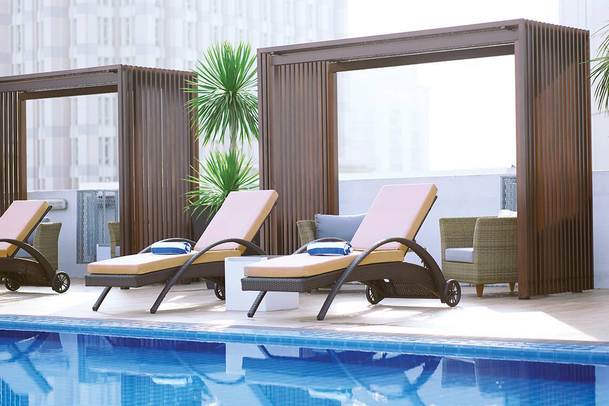 Try our luxurious rooftop infinity swimming pool (cabana seating area)