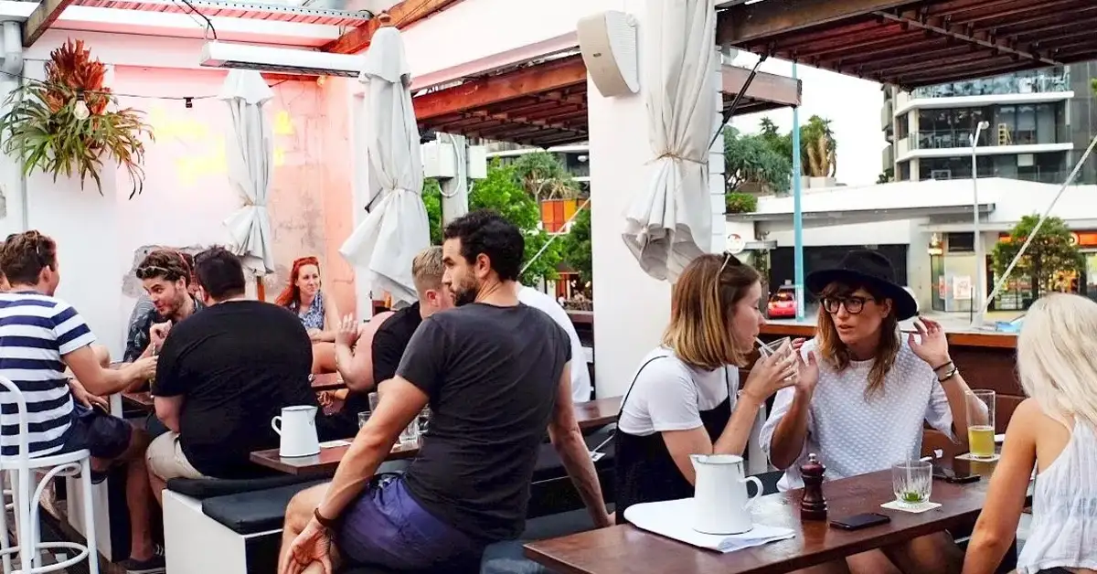 group of people socialising at justin lane rooftop bar