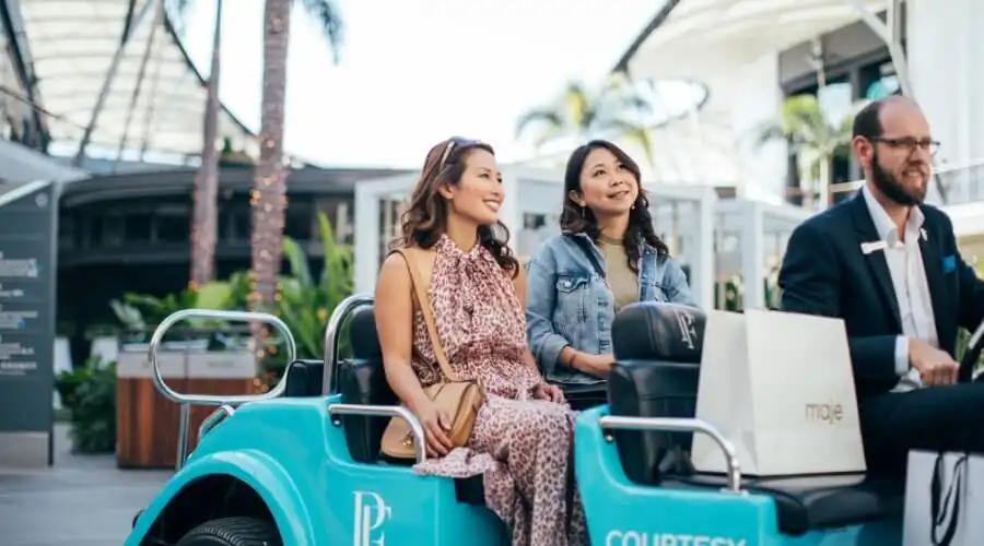 Women on courtesy taxi at Pacific Fair Women on courtesy taxi at Pacific Fair
