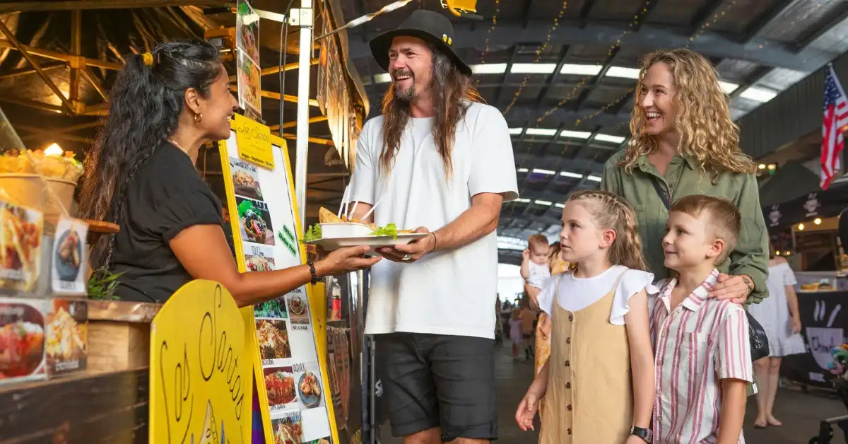 A family enjoys street food at Miami Marketta