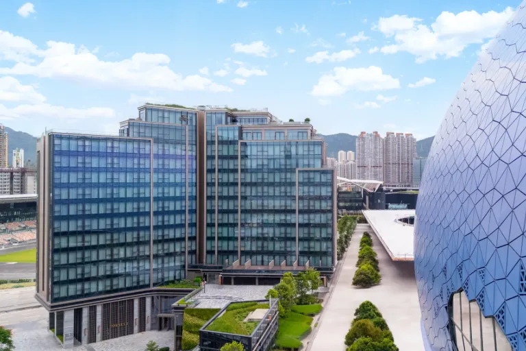 Dorsett Kai Tak pool on the rooftop overlooking the city views.