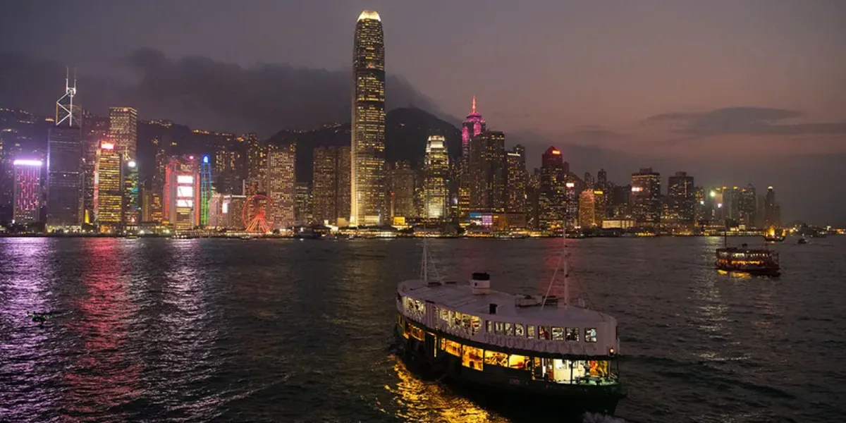 Victoria Harbour at dusk with Hong Kong Island skyline