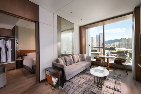 Sofa area in the Executive Harbour View Two-Bedroom Suite at Dorestt Kai Tak