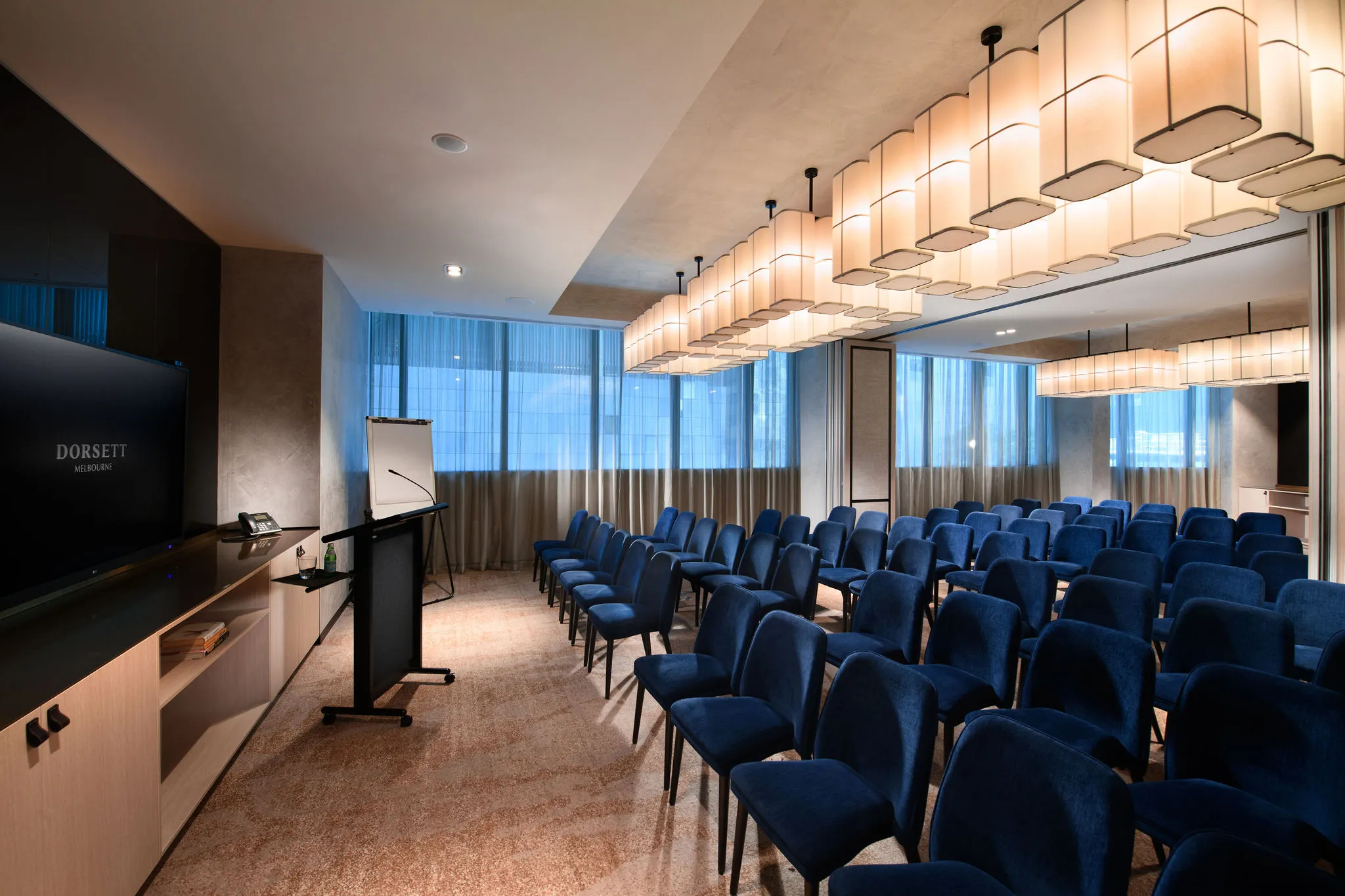 An image of a meeting space set up in theatre style seating arrangement