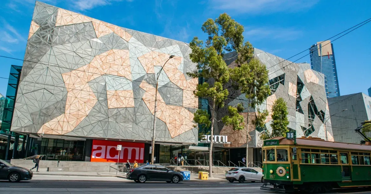 Exterior of ACMI at Federation Square in Melbourne with modern geometric architecture.