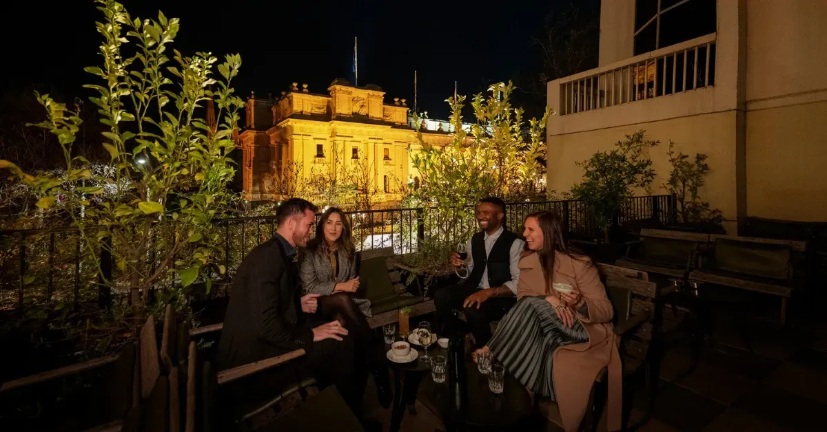 Evening drinks at Siglo rooftop bar overlooking Parliament House in Melbourne.