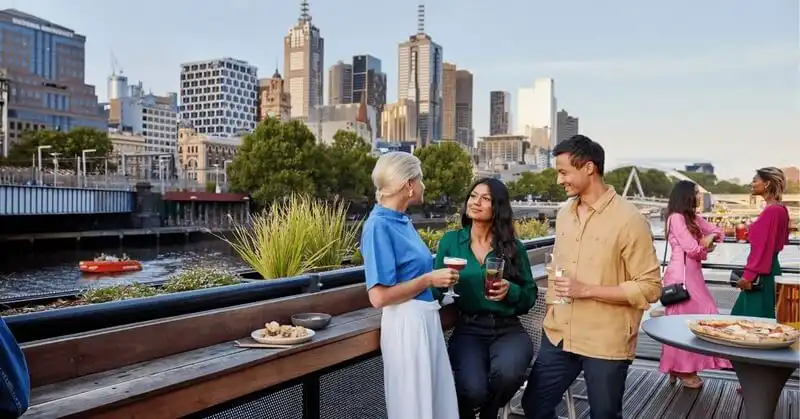 Friends enjoying a drink at Yarra Botanica Friends enjoying a drink at Yarra Botanica
