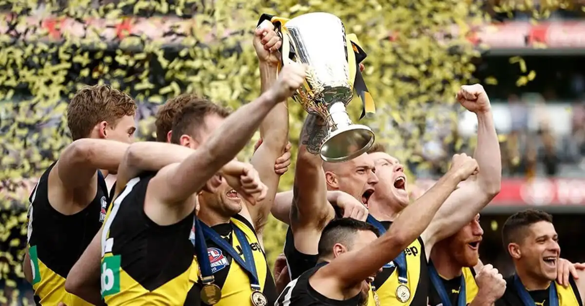 Richmond players celebrate their AFL Grand Final win with the trophy.