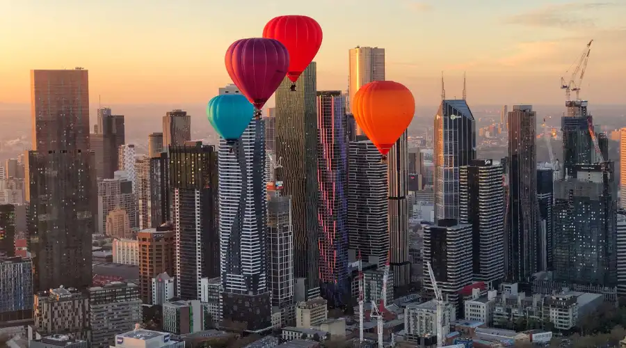 Hot air balloons over Melbourne city skyline