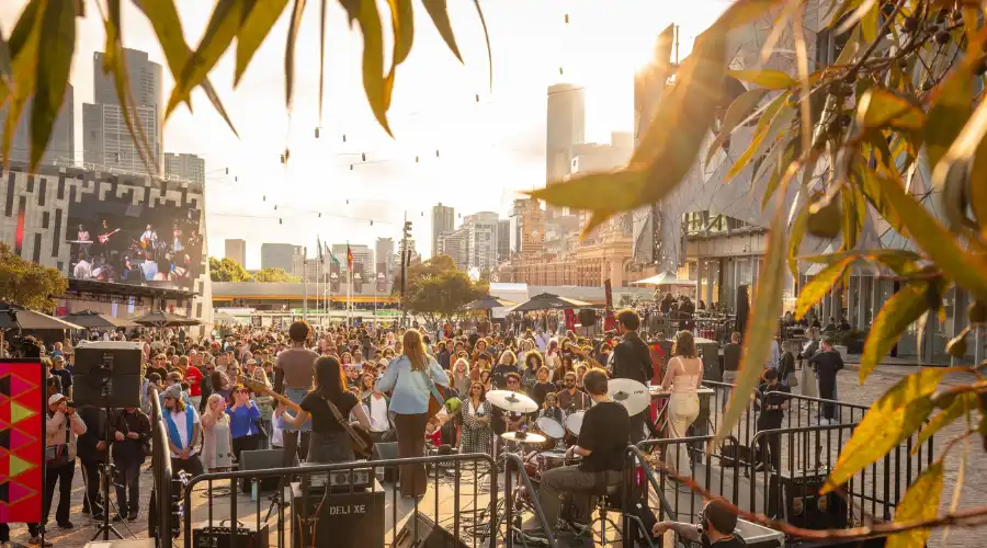 Live band performing at Federation Square during a summer festival