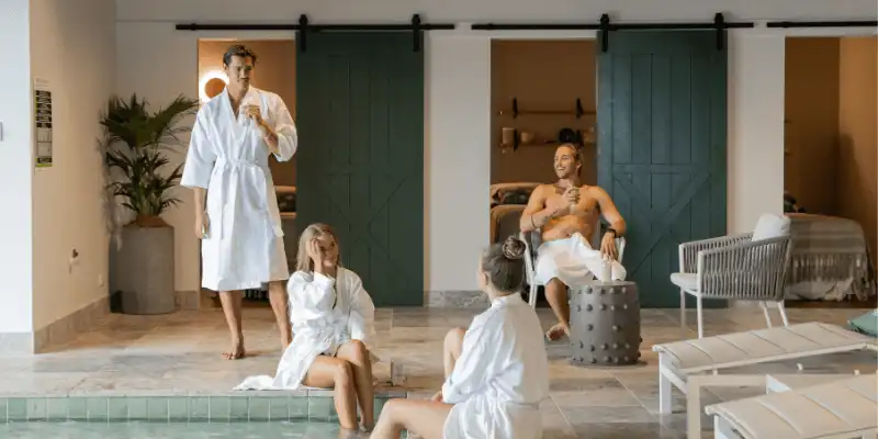 Four people in a bathhouse Four people in a bathhouse
