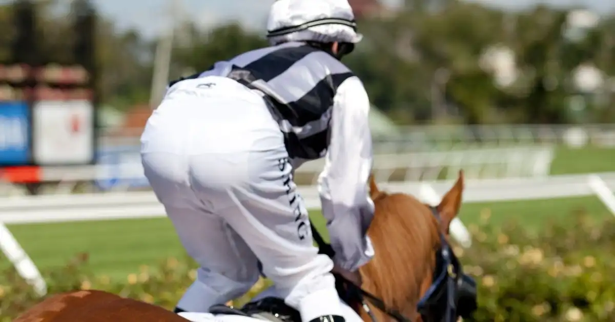 A jockey rides a race horse in the famous Melbourne Cup Carnival