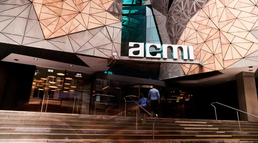 Father and son walk towards entrance of ACMI Melbourne
