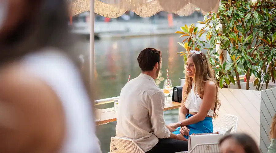 Couple dining by Yarra River Melbourne at Arbory Afloat