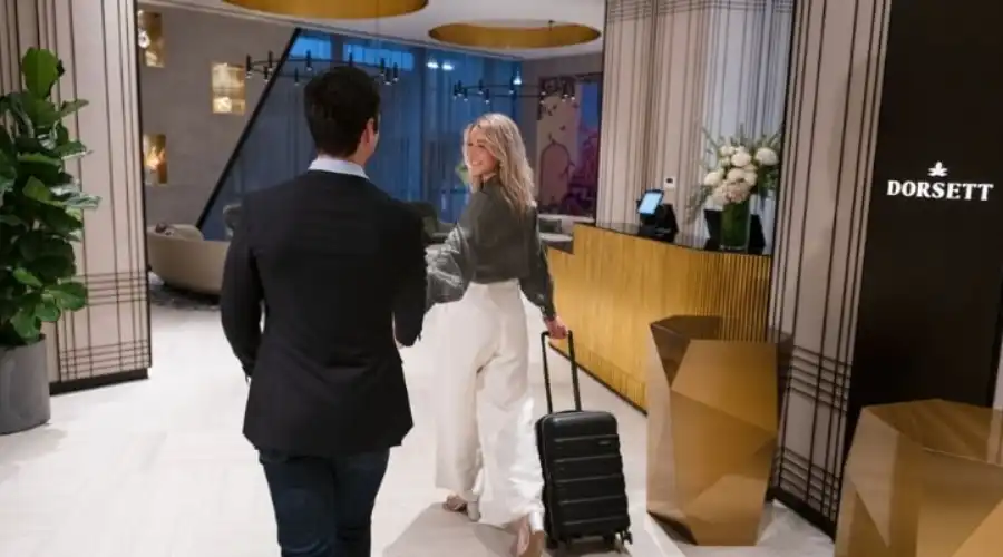 Couple arriving at Dorsett Melbourne hotel lobby