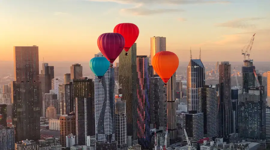 Hot air balloons over Melbourne skyline