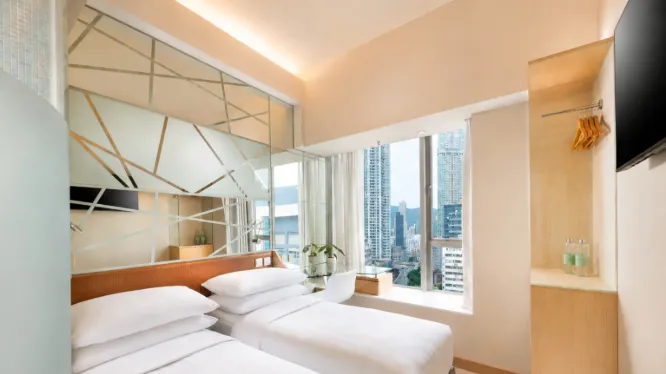 Twin-size bed and amenities in Dorsett Mongkok Superior Room