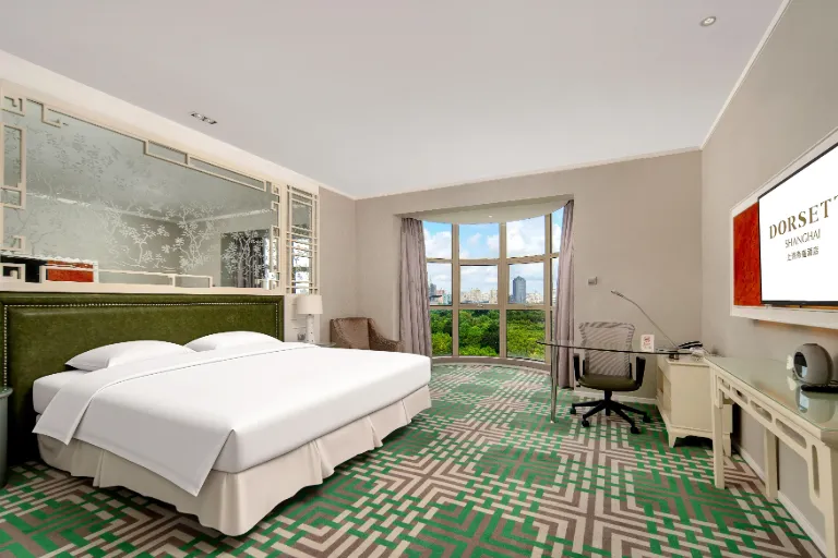 Work desk by two single beds in the Deluxe City View Room.