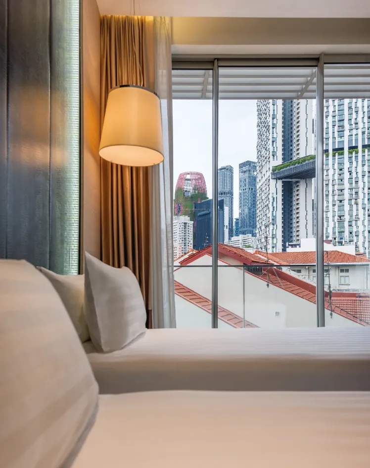 Comfy pillows and view in balcony rooms at Dorsett Singapore.