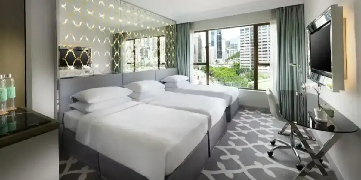 Spacious interior of Deluxe Triple Room at Dorsett Wanchai