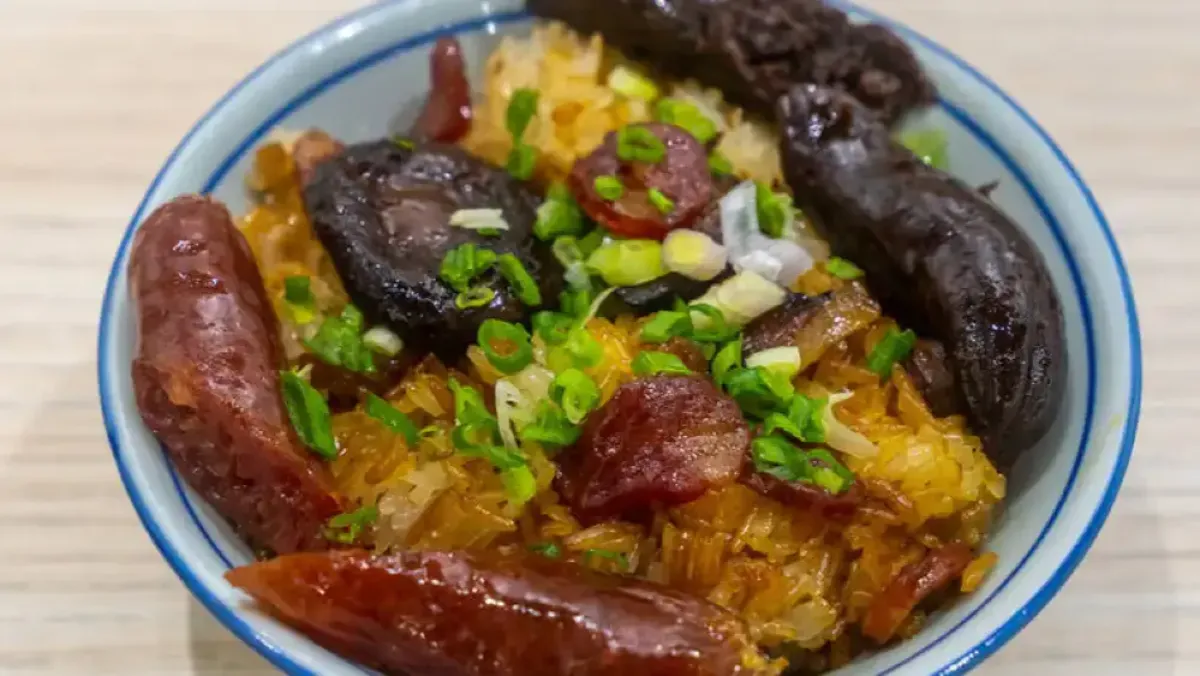Bowl of glutinous rice topped with Chinese cured meats from Keung Kee