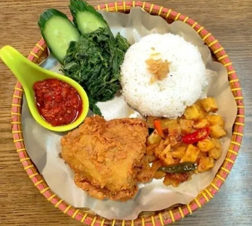 Indonesian traditional food ayam Geprek or fried chicken served with nasi