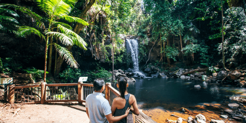 Couple watching a waterfall