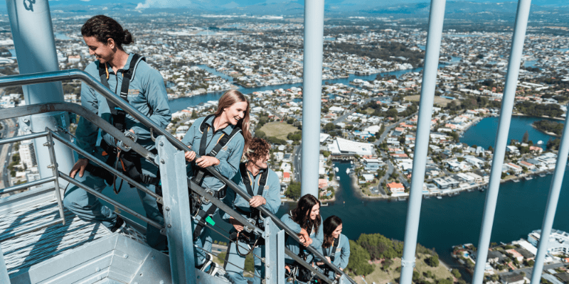 couple climbing skypoint observation deck