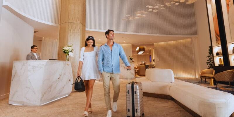 Couple walking through hotel lobby